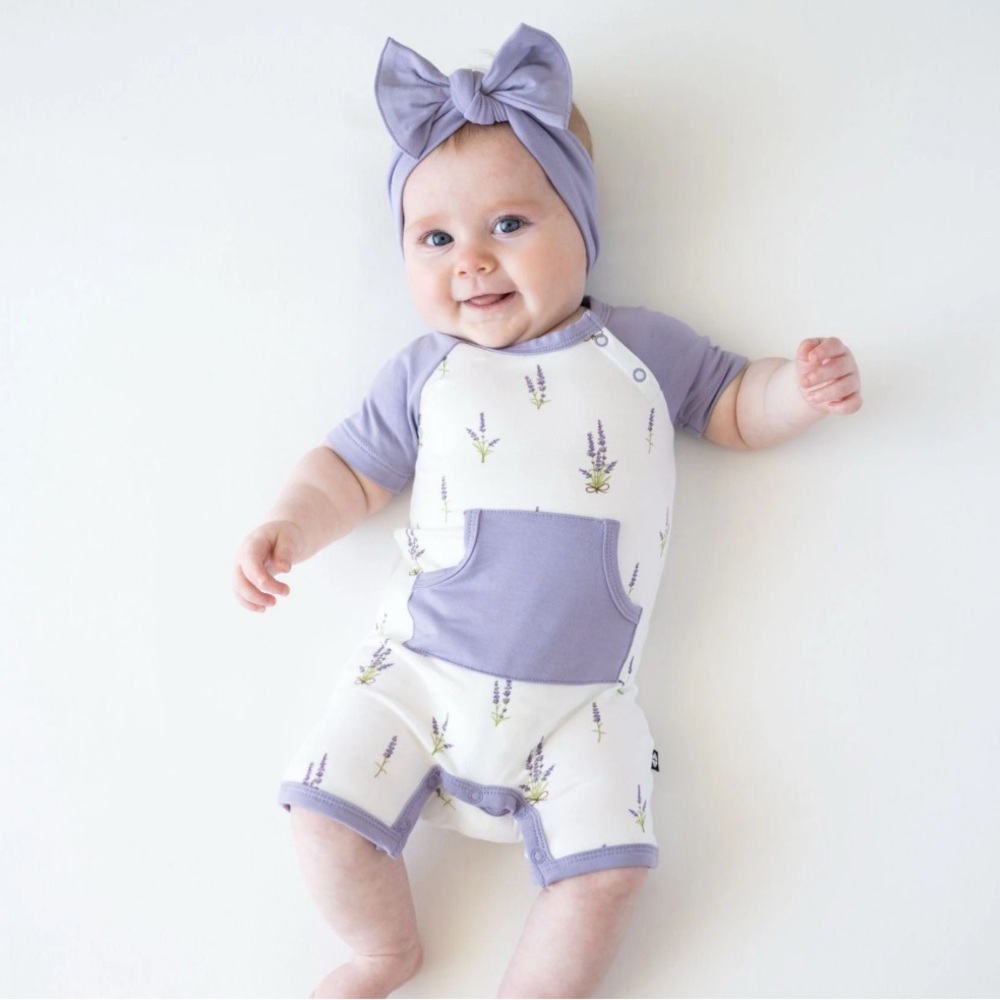 NWOT Kyte baby lavender shortall romper and bow